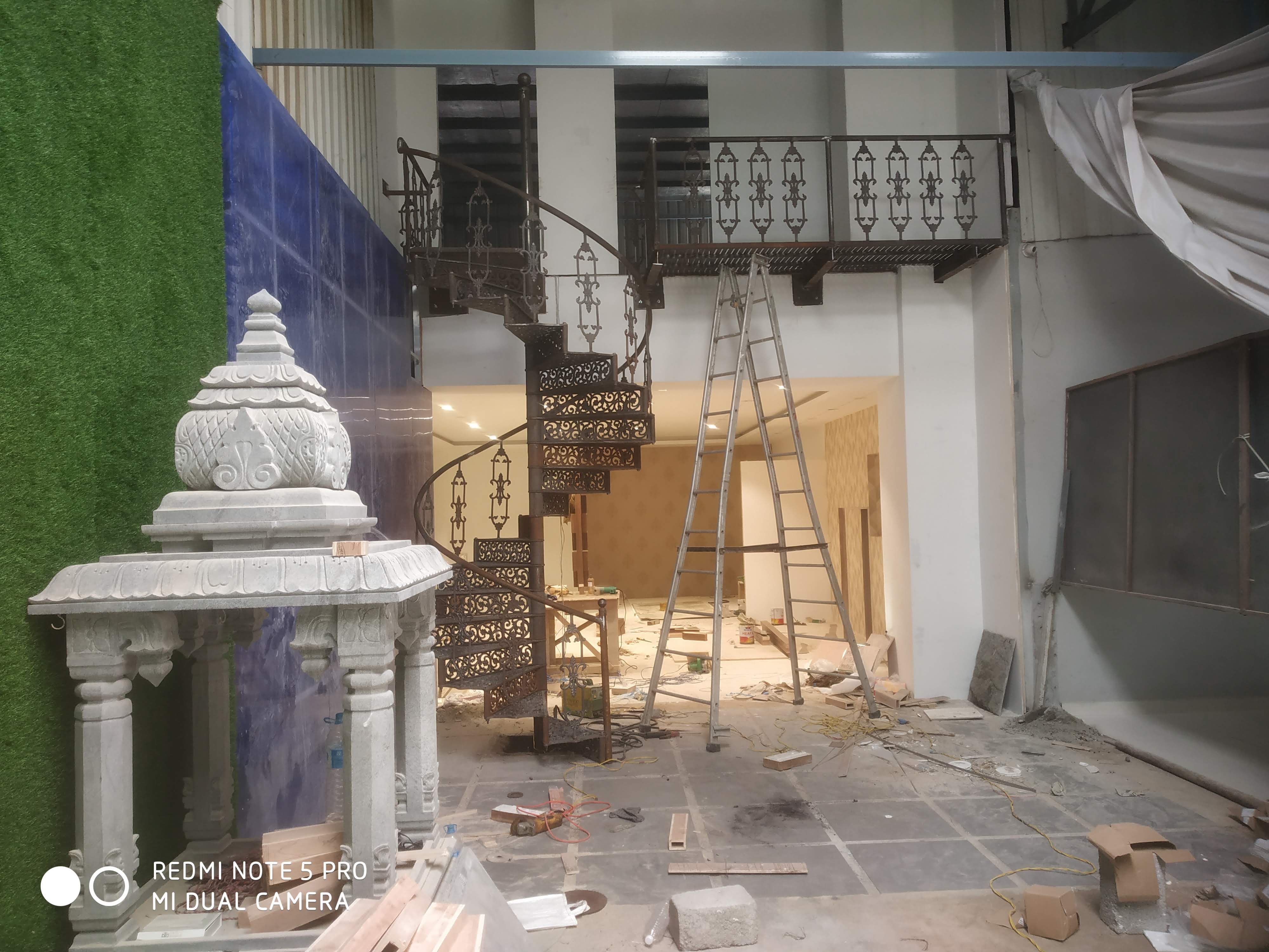 Victorian-style spiral steel staircase fabricated in Salem, Tamil Nadu